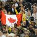 Michigan fans hold up a Canadian flag for freshman Nik Stauskas around during an open practice at the Georgia Dome in Atlanta on Friday, April 5, 2015. Melanie Maxwell I AnnArbor.com